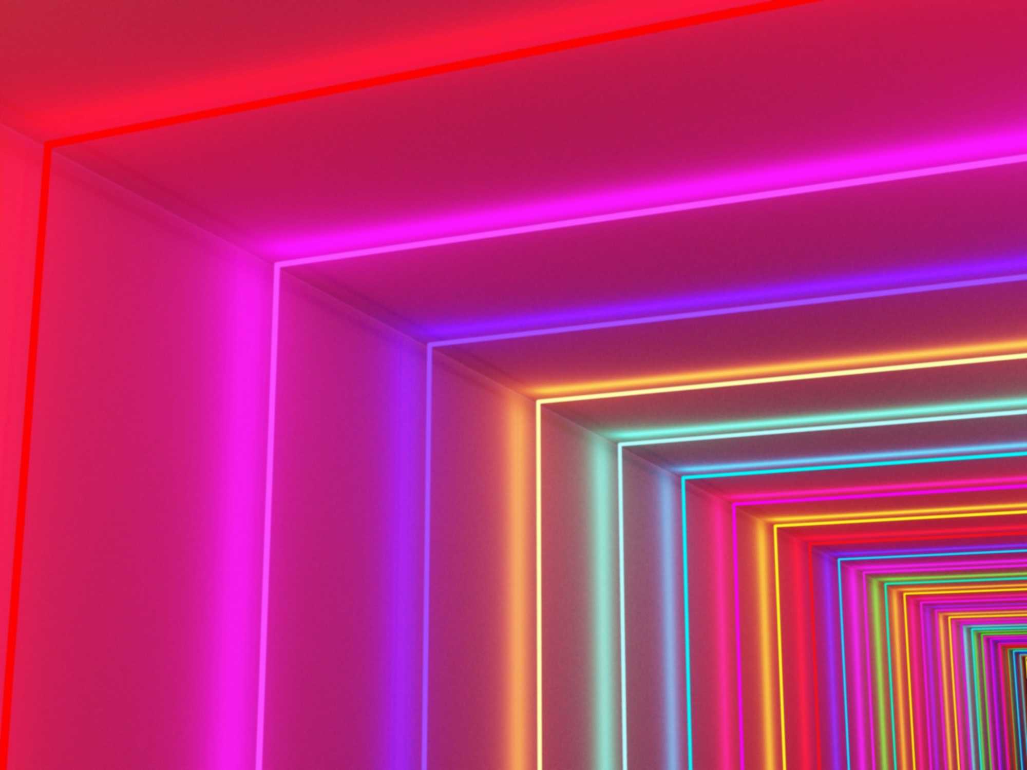 Futuristic neon light tunnel with layered glowing squares representing digital technology and cybersecurity.