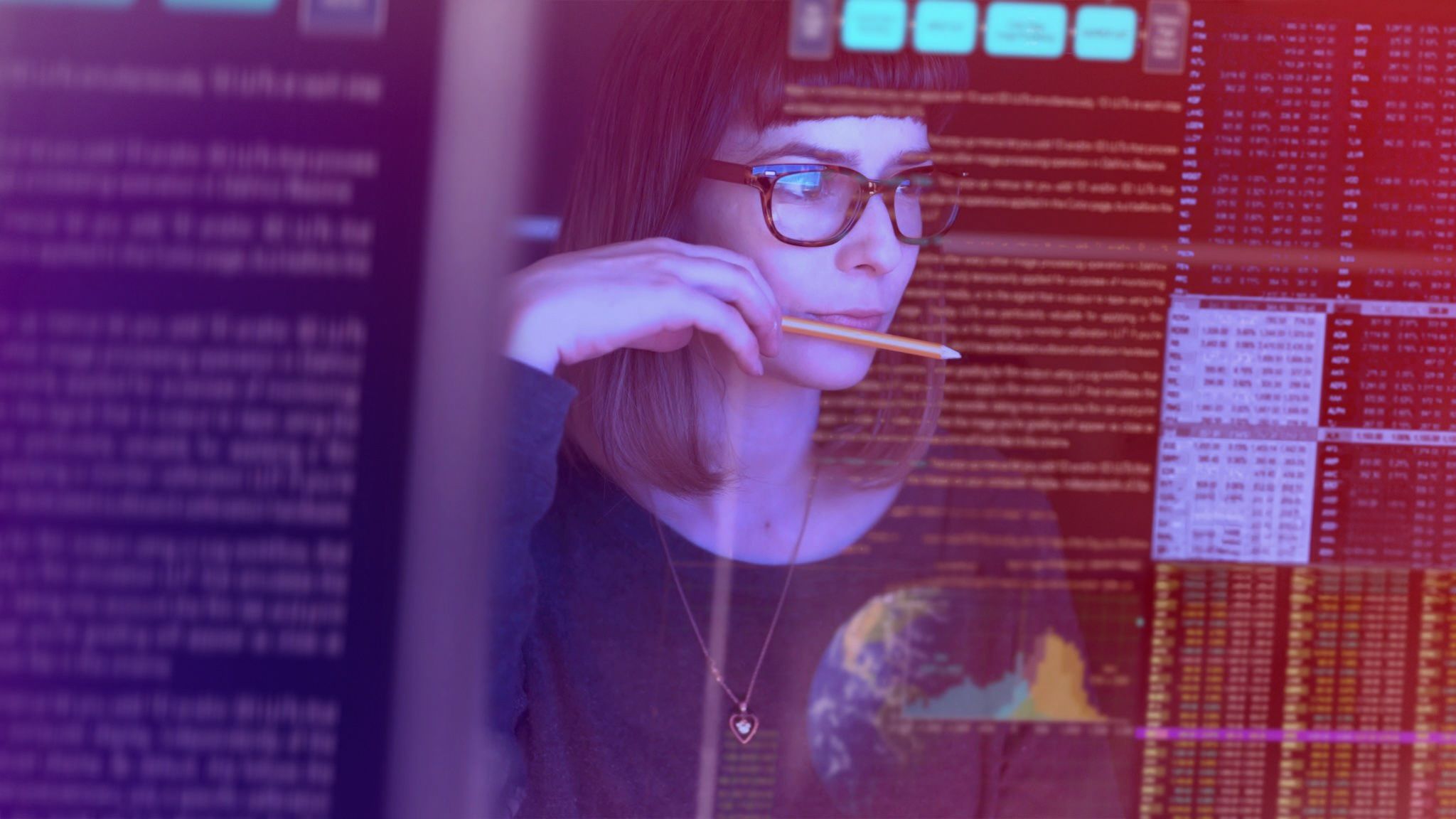 Woman with glasses holding a stylus and looking thoughtfully at data, with code and analytics projected around her in purple and red tones