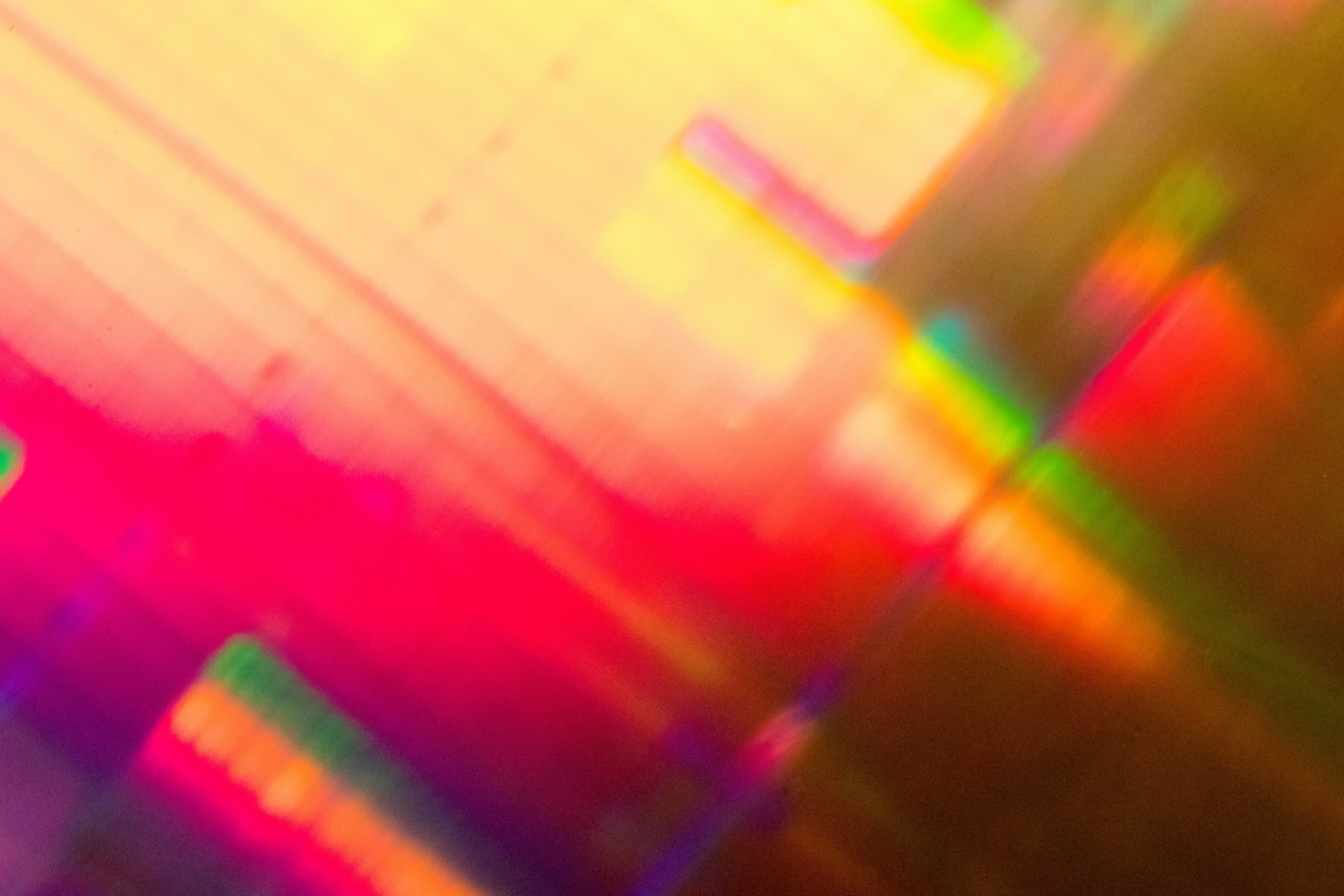 Abstract prism light with vibrant rainbow colors and geometric reflections.