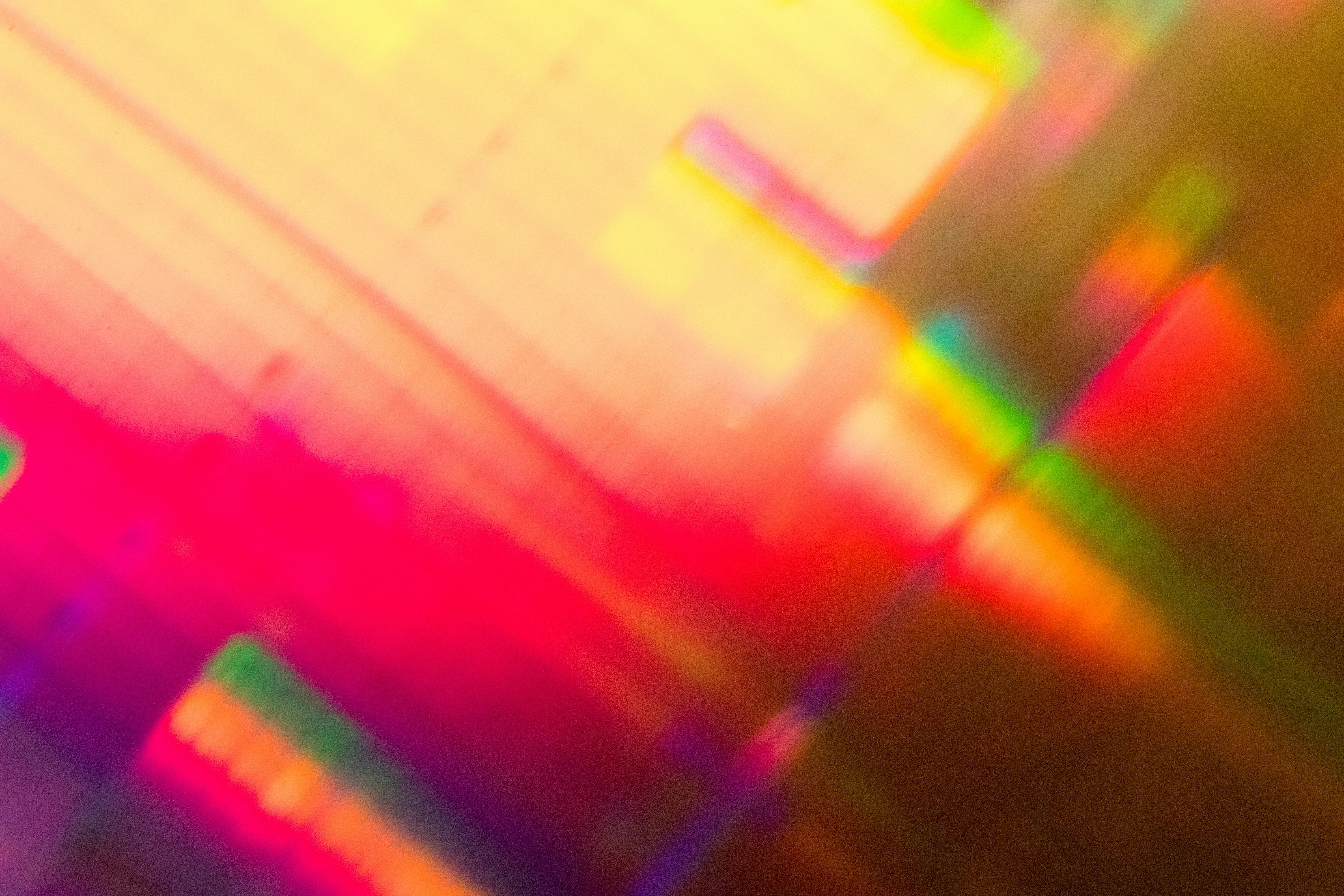 Abstract prism light with vibrant rainbow colors and geometric reflections.
